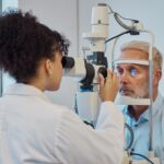 Vision, eye exam and healthcare with a doctor woman or optometrist testing the eyes of a man patien